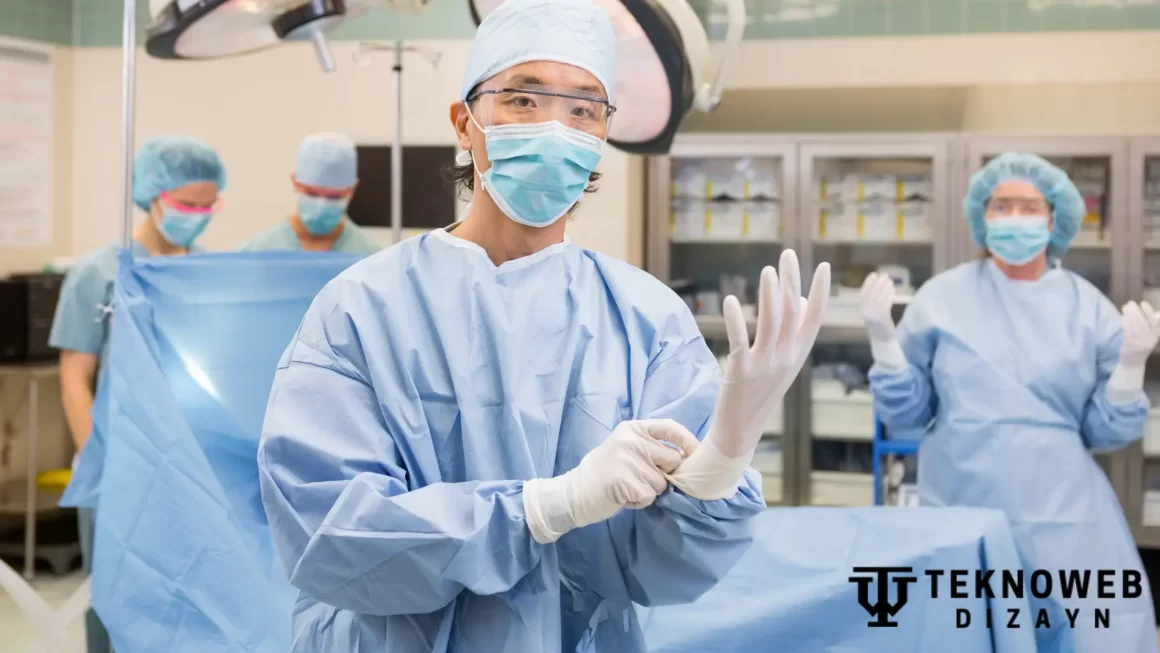 Surgeon wearing gloves in a health theater with medical staff in the background, preparing for surgery. Concept Health Theater Throup.