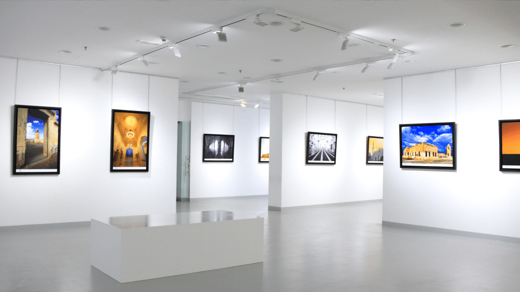 A digital art gallery with modern lighting, displaying vibrant and historical artwork as part of E-Galleries in Art.