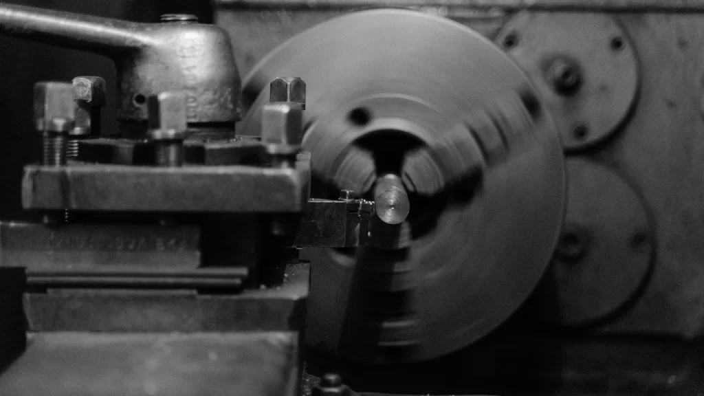 Close-up view of a lathe machine operation highlighting precision machining, symbolizing the question: where are Powermatic tools manufactured?