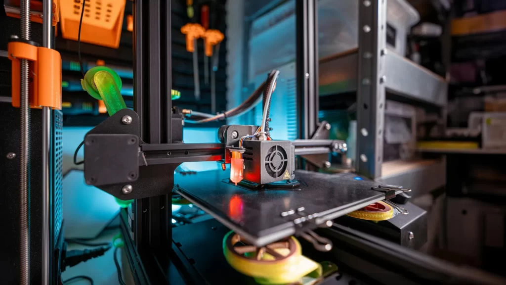 3D printer creating a complex object in a high-tech environment, reflecting innovation and manufacturing practices relevant to where Powermatic tools are manufactured.